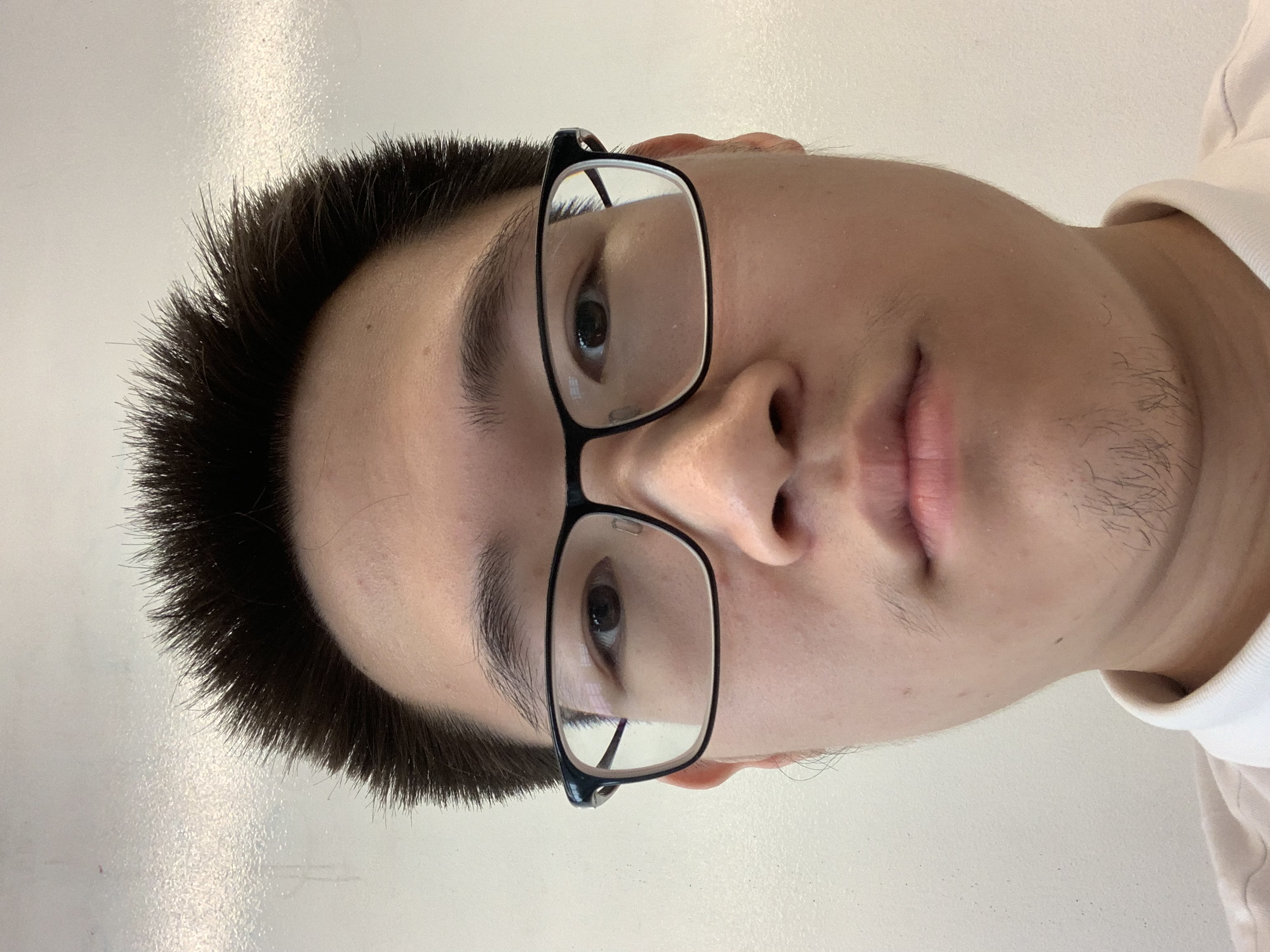 Photo of website designer Benny Wang. Glasses, brown eyes, black hair, Asian